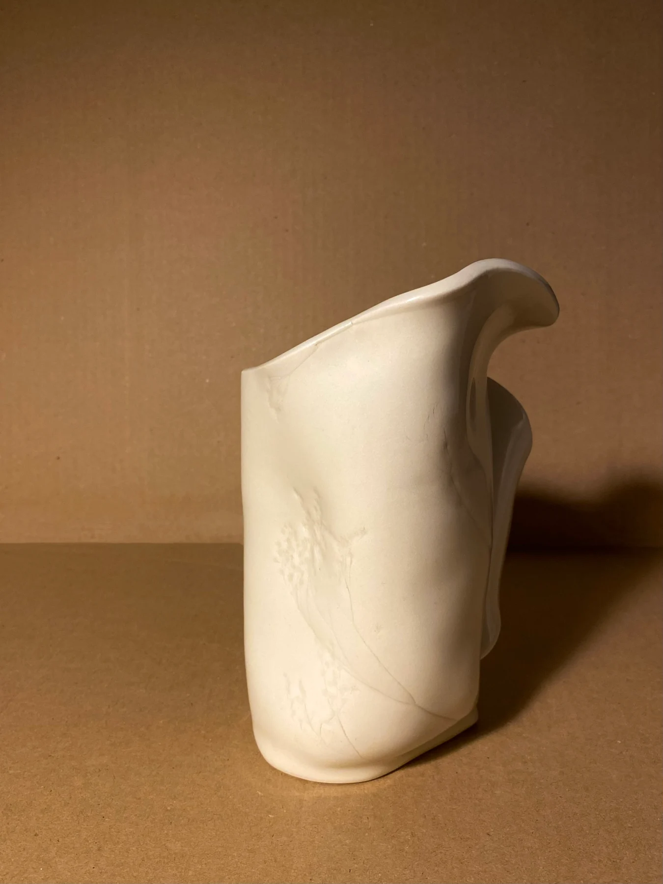 Handbuilt sculptural vase with a softly curved opening